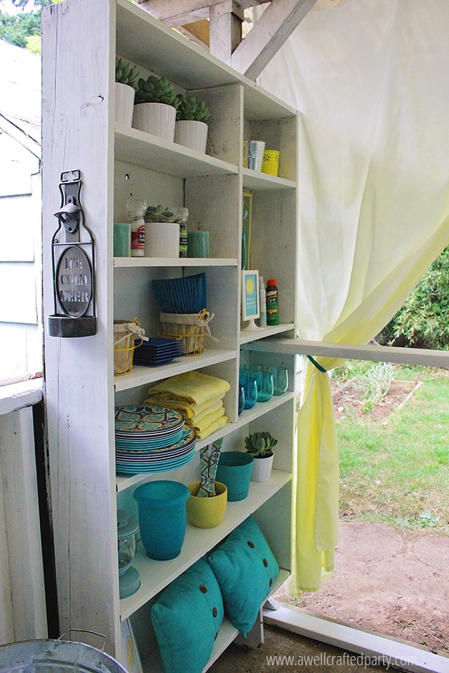 My porch bookshelf houses my many outdoor entertaining items in a neat and organized fashion. 